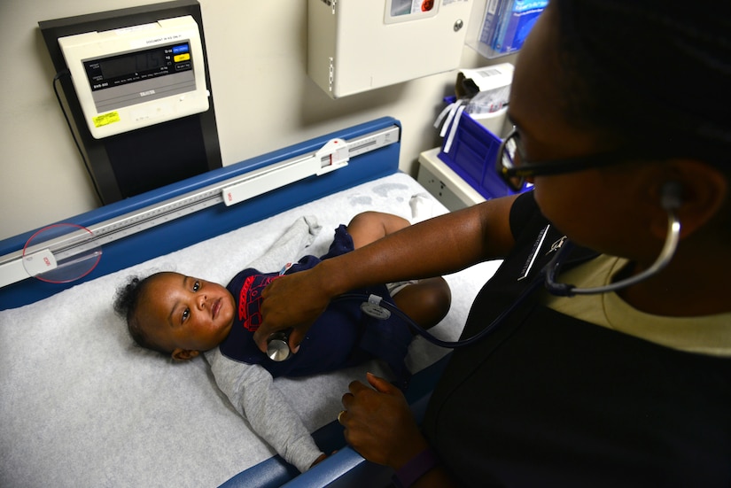 U.S. Air Force Capt. Michella Mayo-Smith, an emergency services clinical nurse from the 633rd Medical Operations Squadron, listens to the lungs of Elijah Menard, five-month-old son of U.S. Navy Petty Officer 1st Class Aved Menard, in the USAF Hospital Langley Emergency Room at Langley Air Force Base, Va., Feb. 26, 2016. The ER staff sees a variety of patients, from pediatrics to geriatrics, with a wide range of ailments on a daily basis. (U.S. Air Force photo by Staff Sgt. Aubrey White)