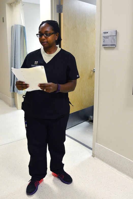 U.S. Air Force Capt. Michella Mayo-Smith, an emergency services clinical nurse from the 633rd Medical Operations Squadron, calls a patient to be triaged in the USAF Hospital Langley Emergency Room at Langley Air Force Base, Va., Feb. 26, 2016. All of the nurses and doctors assigned to the ER specialize in trauma. (U.S. Air Force photo by Staff Sgt. Aubrey White)