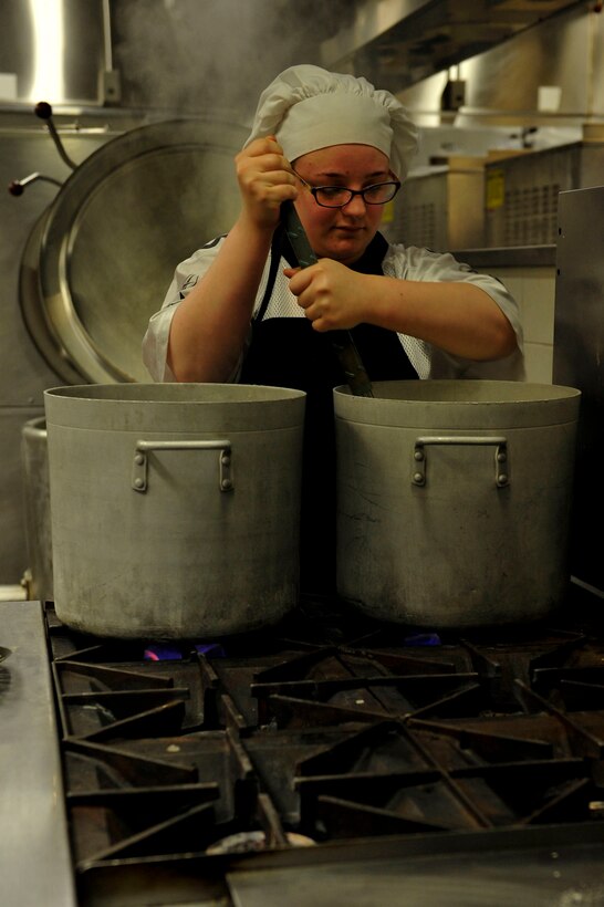 Katie Frinzi, Resolute Dining Facility culinary specialist, stirs soup for the lunch meals at Fort Eustis, Va., March 18, 2016. The culinary specialists begin preparing and cooking meals for lunch as soon as the breakfast crowd leaves. (U.S. Air Force photo by Airman 1st Class Breonna Veal)