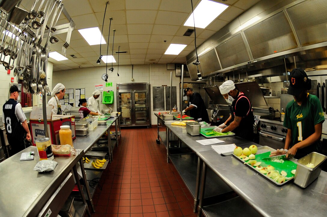 Resolute Dining Facility culinary specialists prepare meals for the lunch crowd at Fort Eustis, Va., March 18, 2016. The dining facility serves approximately 500-700 students a day during the week and approximately 1,500 students on the weekends. (U.S. Air Force photo by Airman 1st Class Breonna Veal)