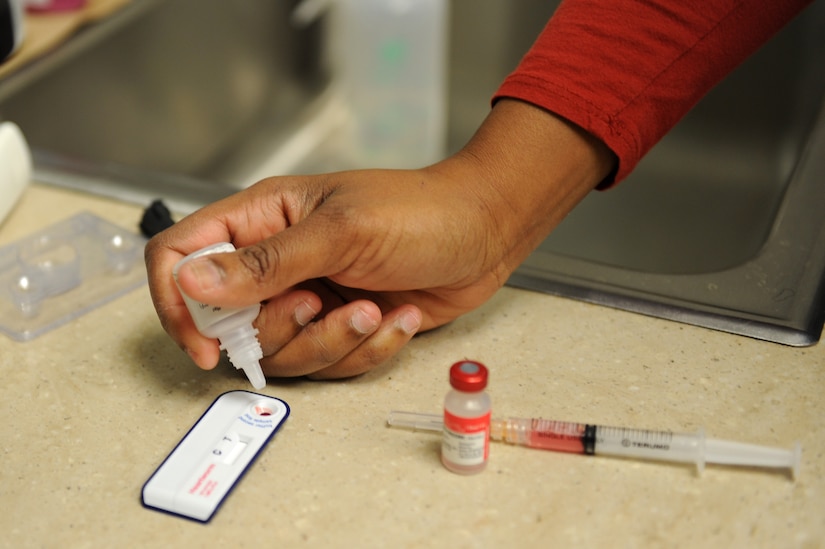 Dr. Nina Griffin, a veterinarian assigned to the Public Health Command-Fort Eustis Branch, performs as Heartworm test during an exam at Langley Air Force Base, Va., March 18, 2016. The Langley Veterinary Clinic offers parasite testing and offers a fully stocked pharmacy for a wide variety of prescriptions their patients may need. (U.S. Air Force photo by Senior Airman Brittany E. N. Murphy)
