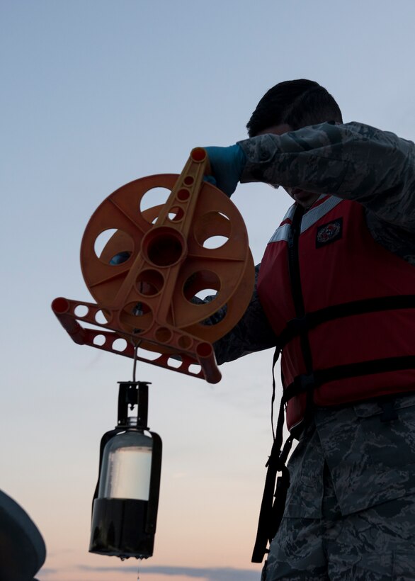 U.S. Air Force Senior Airman Jeremiah Garfoyle, a fuels laboratory technician assigned to the 733rd Logistics Readiness Squadron, collects fuel from an incoming shipment at Langley Air Force Base, Va., March 18, 2016.  During the shipment, the base received 714,000 gallons of Jet A1 fuel which the T-38 Talon and F-22 Raptor use. (U.S. Air Force photo by Airman 1st Class Derek Seifert)