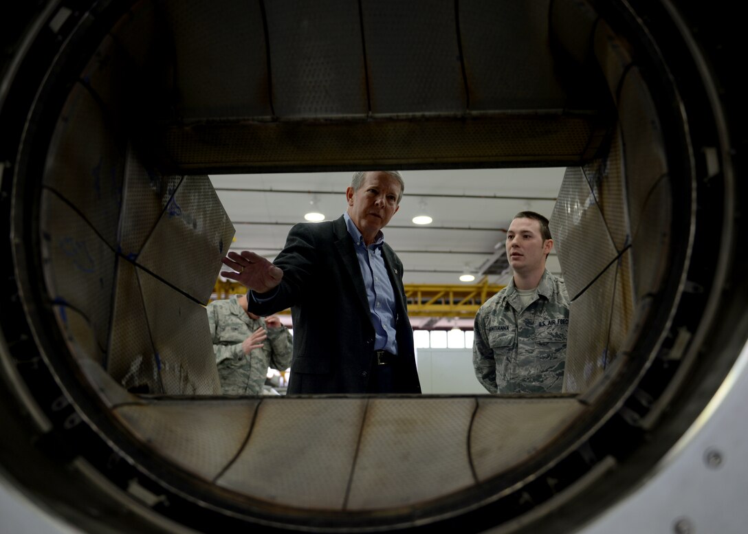 U.S. Air Force Tech. Sgt. Patterson, a weapons load crew chief assigned to the 1st Maintenance Group, briefs retired Chief Master Sgt. of the Air Force Rodney J. McKinley on the weapons at Langley Air Force Base, Va., March 18, 2016. McKinley served as a crew chief for the 3rd Tactical Fighter Wing at Clark Air Force Base, Philippines, from June 1987 to 1991 before serving as the top enlisted Airman. (U.S. Air Force photo by Airman 1st Class Kaylee Dubois)