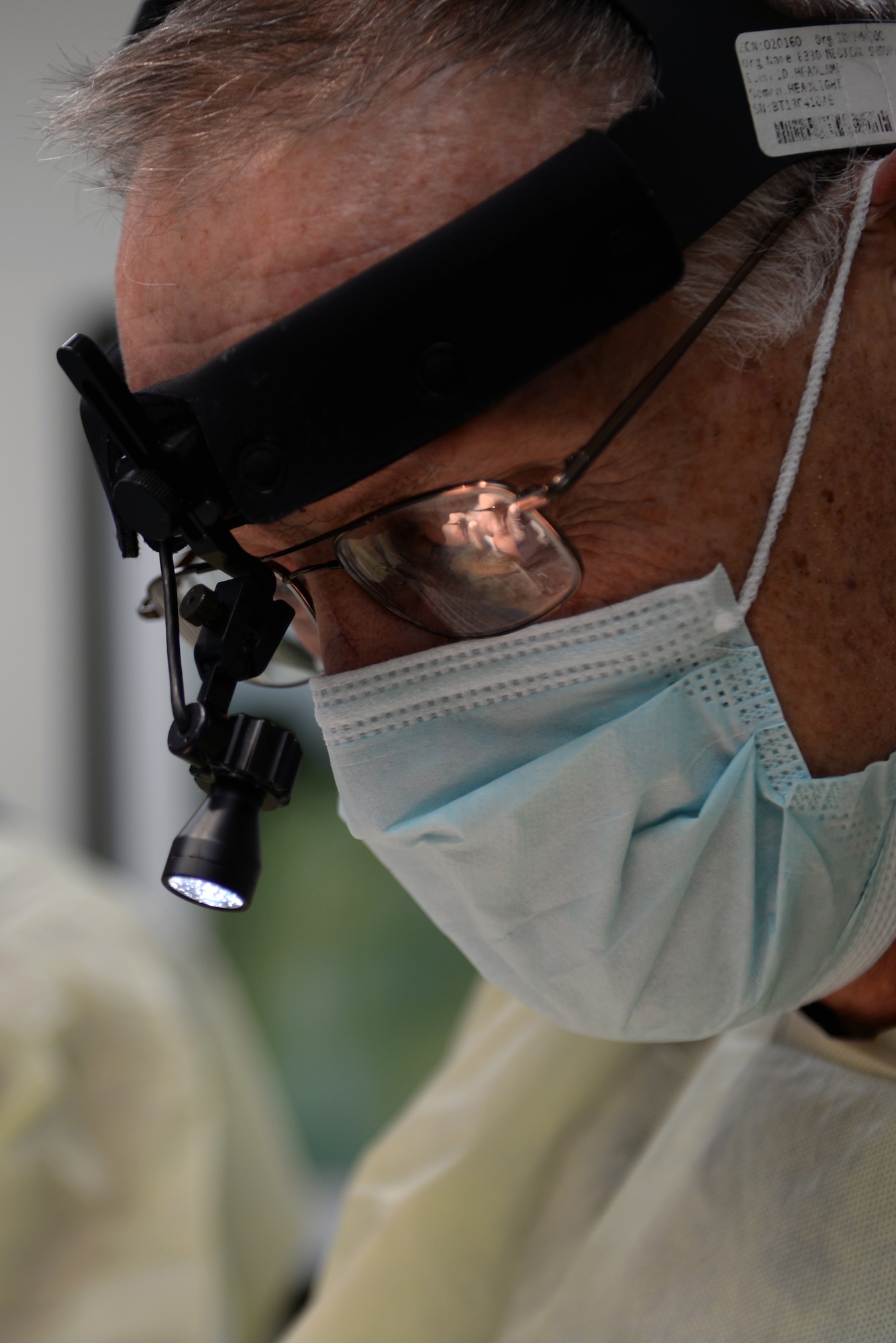 U.S. Air Force Lt. Col Marshall Humes, oral and maxillofacial surgeon assigned to the 633rd Medical Group, performs oral surgery at Langley Air Force Base, Va., March 17, 2016. In about 20 minutes, Humes can perform a wisdom teeth removal and prep the patient for a quick recovery. (U.S. Air Force photo by Airman 1st Class Kaylee Dubois)