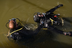 U.S. Army Spc. David Plummer, a second class diver with the 569th Engineer Dive Detachment, rescues Sgt. Gordon Yeaple, a salvage diver and noncommissioned officer in charge with the 569th Engineer Dive Detachment, during a Salvage Dive Rodeo training at Fort Eustis, Va., March 18, 2016. The rodeo is a yearly upgrade training event that allows divers to accomplish tasks that they were not introduced to in the field. (U.S. Air Force photo by Staff Sgt. Natasha Stannard)