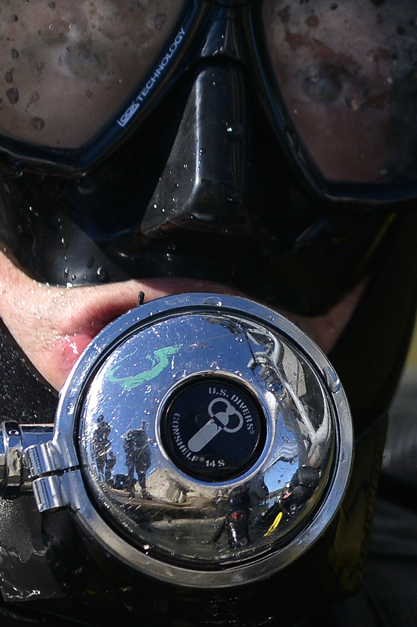 U.S. Army safety divers with the 569th Engineer Dive Detachment stand-by as Sgt. Gordon Yeaple, a salvage diver and noncommissioned officer in charge with the 569th Engineer Dive Det., dives into the James River at Fort Eustis, Va., March 18, 2016. As part of a yearly training, Yeaple simulated being unconscious due to breathing in too much carbon monoxide, so that the safety swimmer could complete a rescue task to upgrade his proficiency as a diver. (U.S. Air Force photo by Staff Sgt. Natasha Stannard)