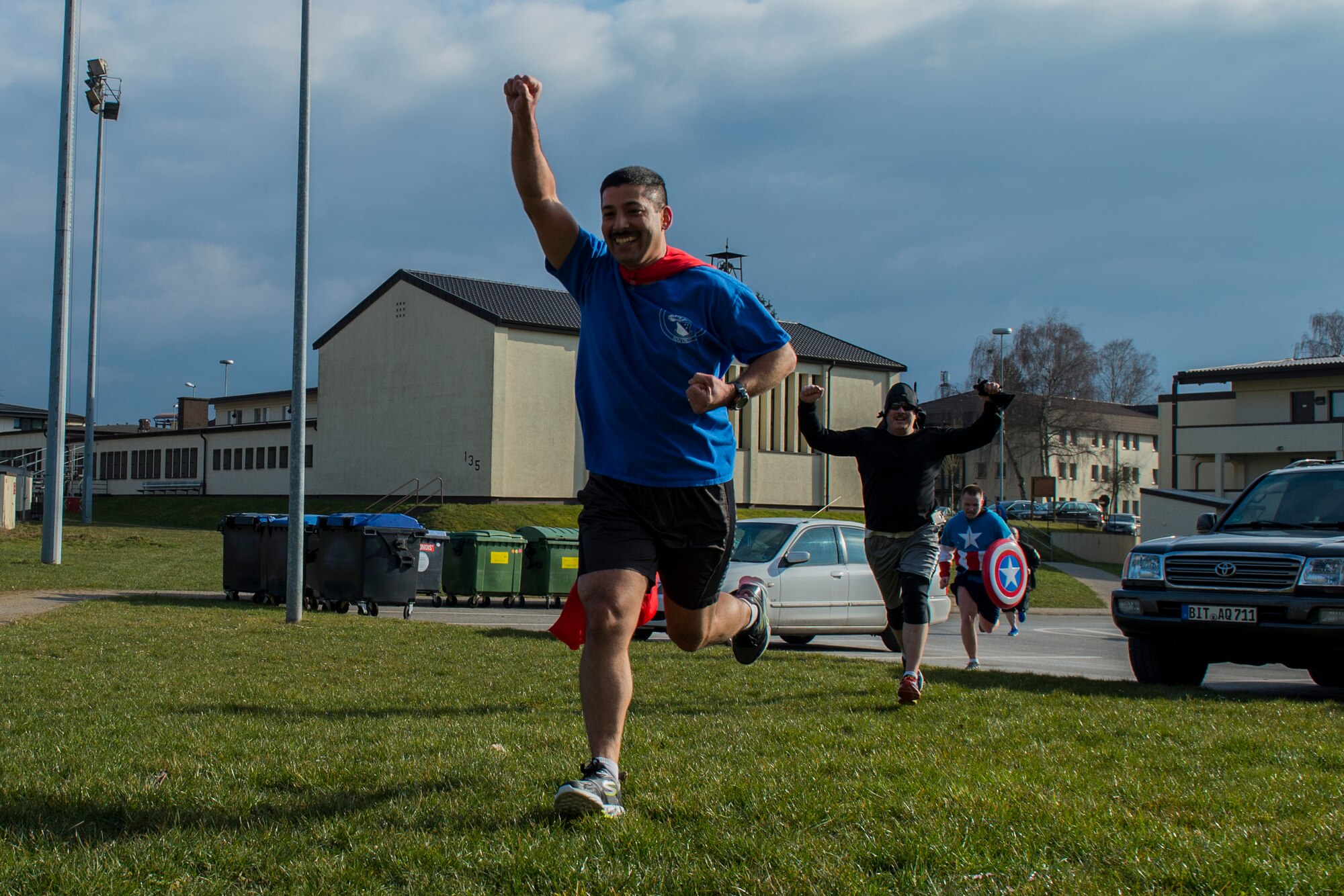 Team “SuperFly” celebrates as they finish in first place during the Amazing Nutrition 5k Challenge at Spangdahlem Air Base, Germany, Mar. 22, 2016. The winners received a bag filled with nutritional items to promote physical resiliency. (U.S. Air Force photo by Senior Airman Luke Kitterman/Released)