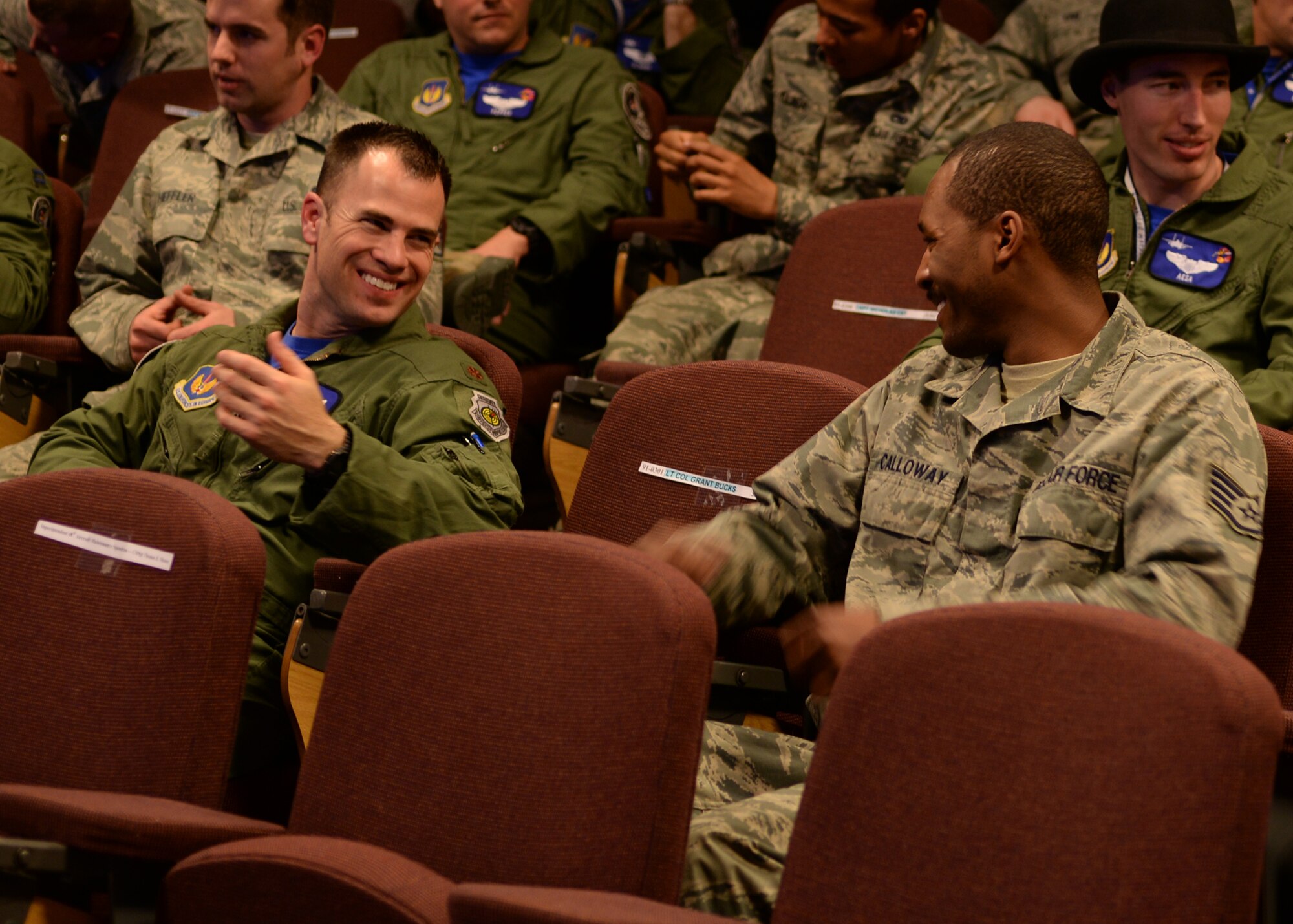Pilots and their crew chiefs from the 492nd Fighter Squadron engage in conversation prior to the dedicated crew chief ceremony March 18, 2016 at Royal Air Force Lakenheath, England. Friends and co-workers gathered to watch as their colleagues affirm the crew chief oath followed by the receiving coins, certificates, and warm acknowledgments from 48th Aircraft Maintenance Squadron commander, Lieutenant Colonel Joseph Deporter and the 492nd and 494th aviation community. (U.S. Air Force photo/ Technical Sgt. Matthew Plew)
