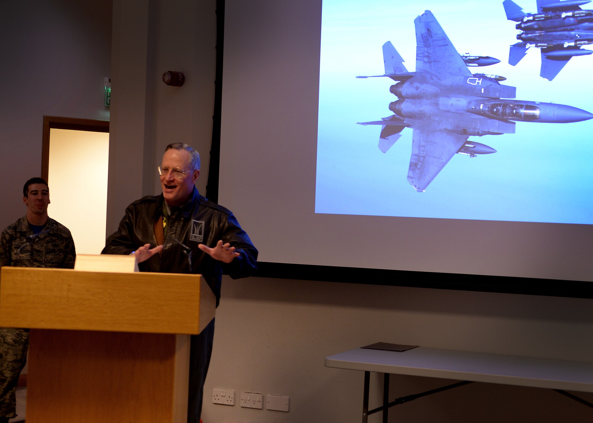 U.S. Air Force veteran Ross Perot Jr. speaks to pilots and crew chiefs from the 492nd and 494th fighter squadrons during a dedicated crew chief ceremony March 18, 2016 at Royal Air Force Lakenheath, England. The Liberty wing inducted 33 aircraft maintenance experts as the newest crop of dedicated crew chiefs. (U.S. Air Force photo/ Technical Sgt. Matthew Plew)