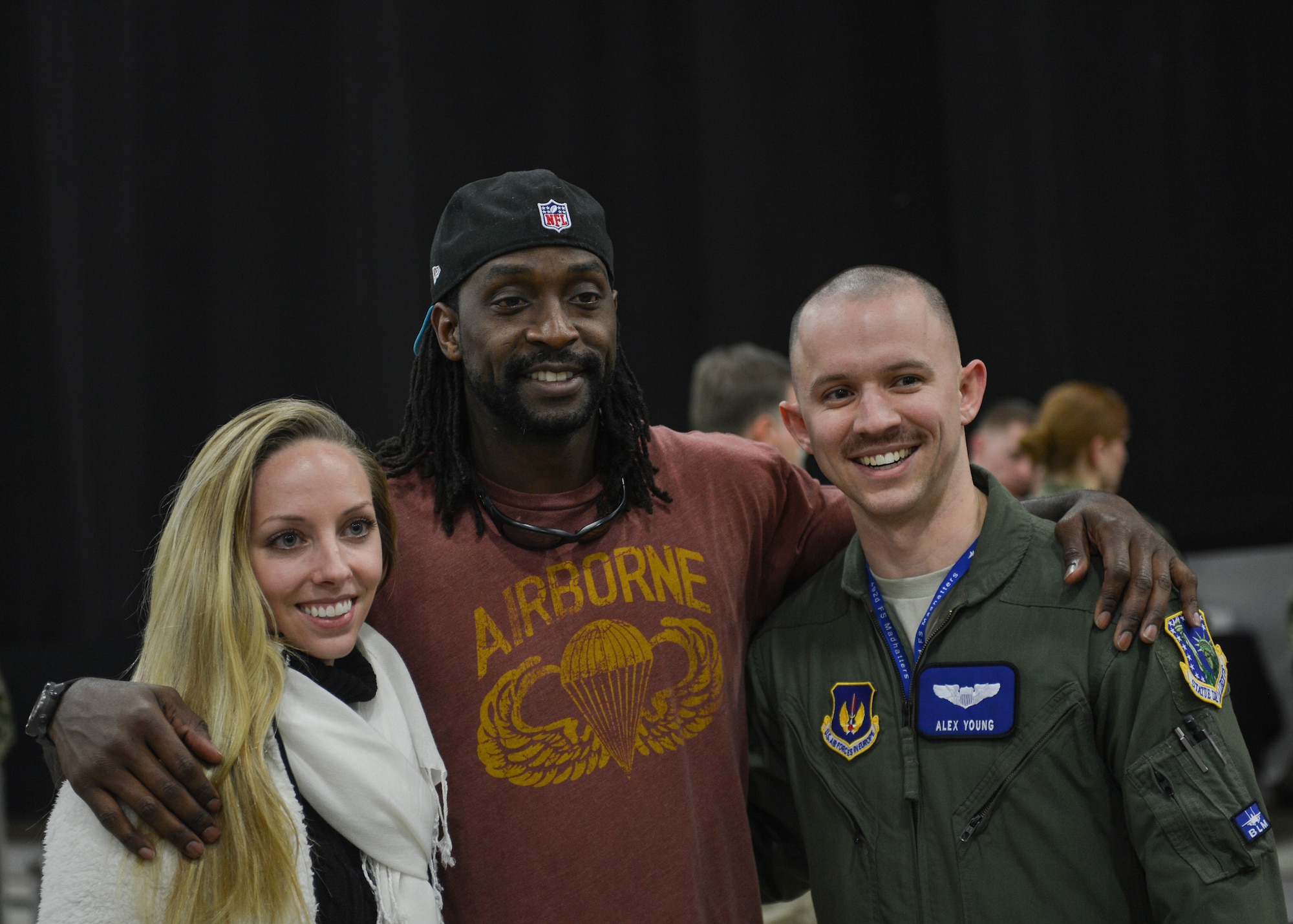 Charles “Peanut” Tillman, cornerback for the North Carolina Panthers, poses for a photo with fans during the United Service Organizations tour at Royal Air Force Lakenheath, England, March 16, 2016. Over the course of two hours, five celebrities entertained more than 400 attendees with interactive speeches, question and answer engagements and live performances. (U.S. Air Force photo/Senior Airman Nigel Sandridge) 