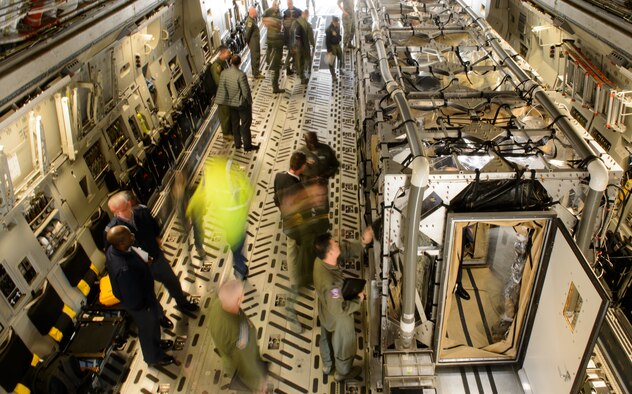 Medical professionals look at a transport isolation system aboard a C-17 Globemaster III during the Aerospace Medicine Summit and NATO Science and Technology Organization Technical Course March 17, 2016, at Ramstein Air Base, Germany. The transport isolation system is an innovative capability that allows the Department of Defense to provide aeromedical evacuation for patients with known or suspected exposure to a contagious and infectious disease, including the Ebola virus and severe acute respiratory syndrome, and to protect the airframe, aircrew and support personnel as well as provide worldwide patient transport capability in case of a biological event. More than 200 attendees from 23 nations took part in the summit to discuss this year’s focus on “Aerospace Medicine-From the Ground Up.” (U.S. Air Force photo/ Staff Sgt. Armando Schwiermorales)