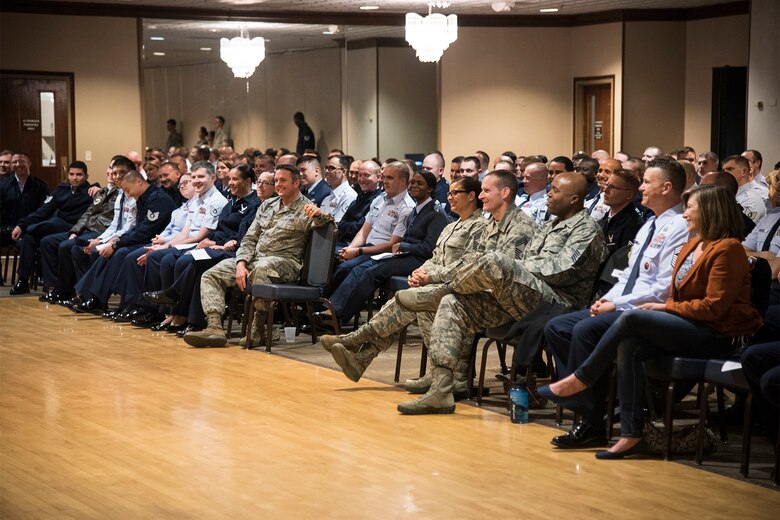 PETERSON AIR FORCE BASE, Colo. – Members of Team Pete and Noncommissioned Officer Academy students laugh as they listen to Master Sgt. Israel Del Toro telling his story at the Air Force Sergeants Association monthly general meeting at the Peterson Club, March 16, 2016. Del Toro attended the meeting as the guest speaker and spoke about the challenges he faced growing up, being injured in Afghanistan and turning his struggles into success. (U.S. Air Force photo by Staff Sgt. Tiffany DeNault)