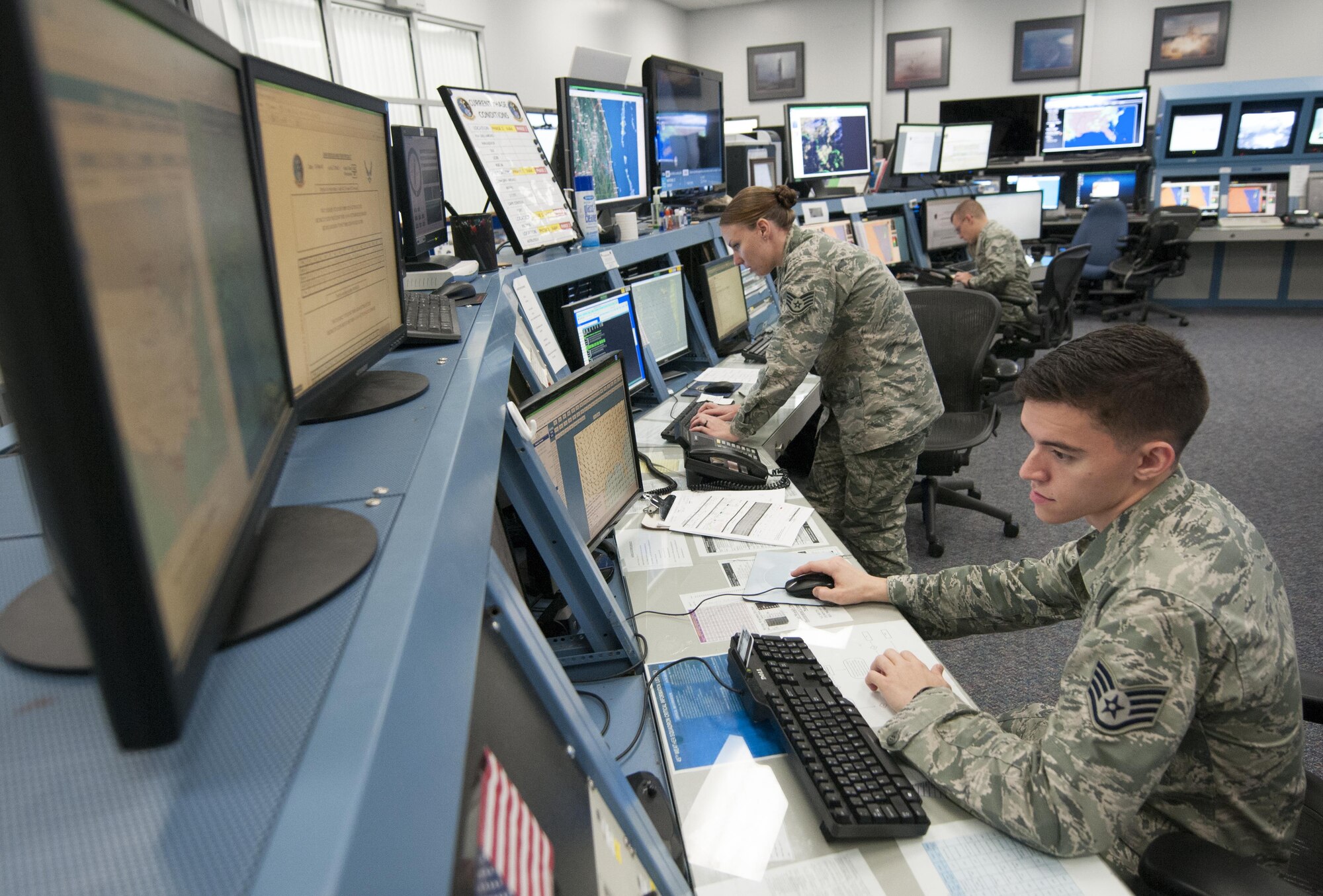 Staff Sgts. Brad Owens and Stephanie Cole, and Senior Airman Henry Lero, both of the range weather forecasters with the 45th Weather Squadron, collect data ahead of an upcoming space launch from Cape Canaveral Air Force Station, Fla., Feb. 24, 2016. The squadron uses more than $80 million worth of equipment to analyze weather patterns in the 500-square-mile area. (U.S. Air Force photo/Sean Kimmons)
