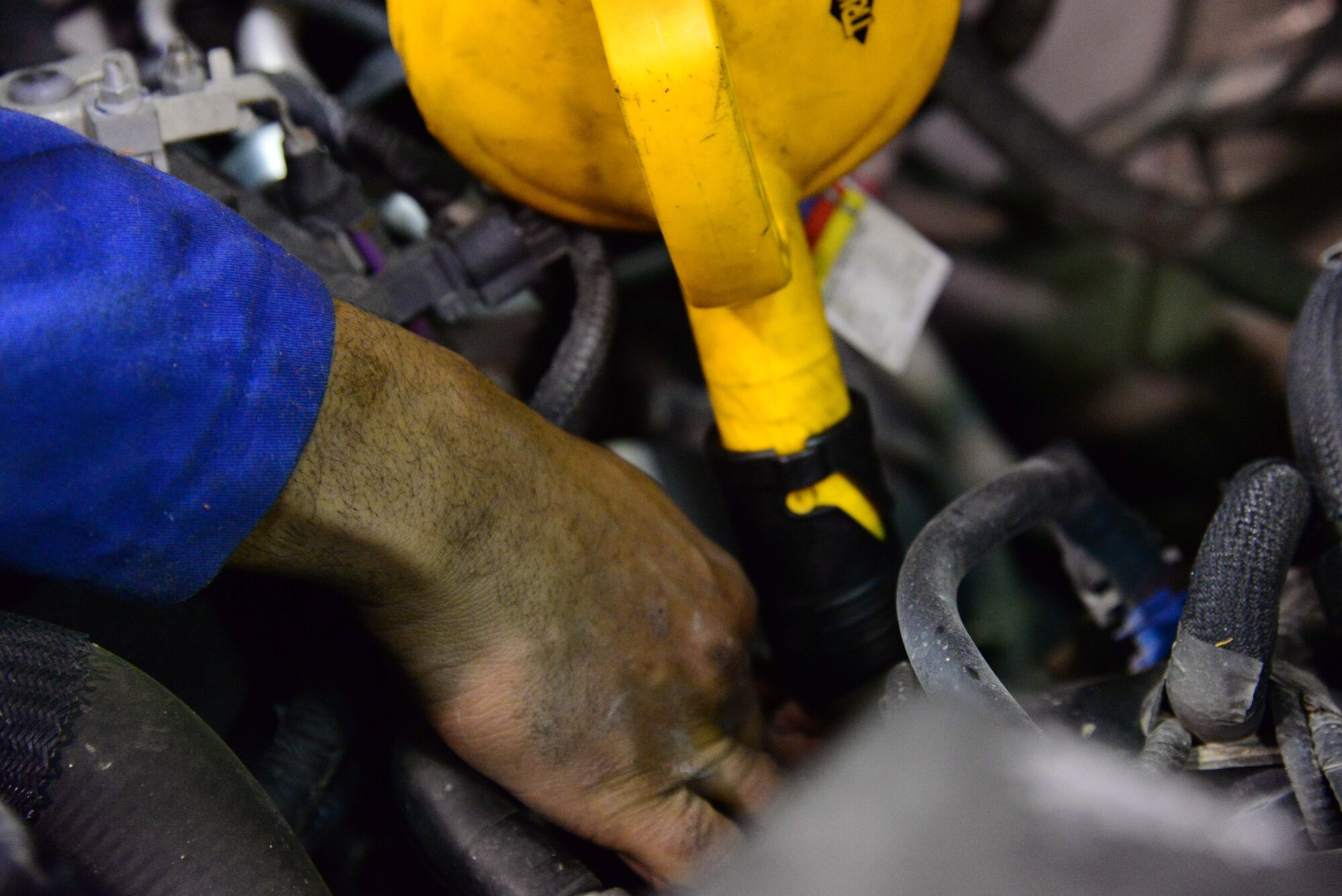 Senior Airman Jovan Lucaschamberlain, 341st Logistics Readiness Squadron vehicle management flight mechanic, pours oil into a government vehicle March 22, 2016, at Malmstrom Air Force Base, Mont. The 341st LRS vehicle management flight has been chosen to participate to test out a new bio-based synthetic oil to be used in six of the 341st Missile Wing’s vehicles for the next 12-18 months.  (U.S. Air Force photo/Airman 1st Class Magen M. Reeves)