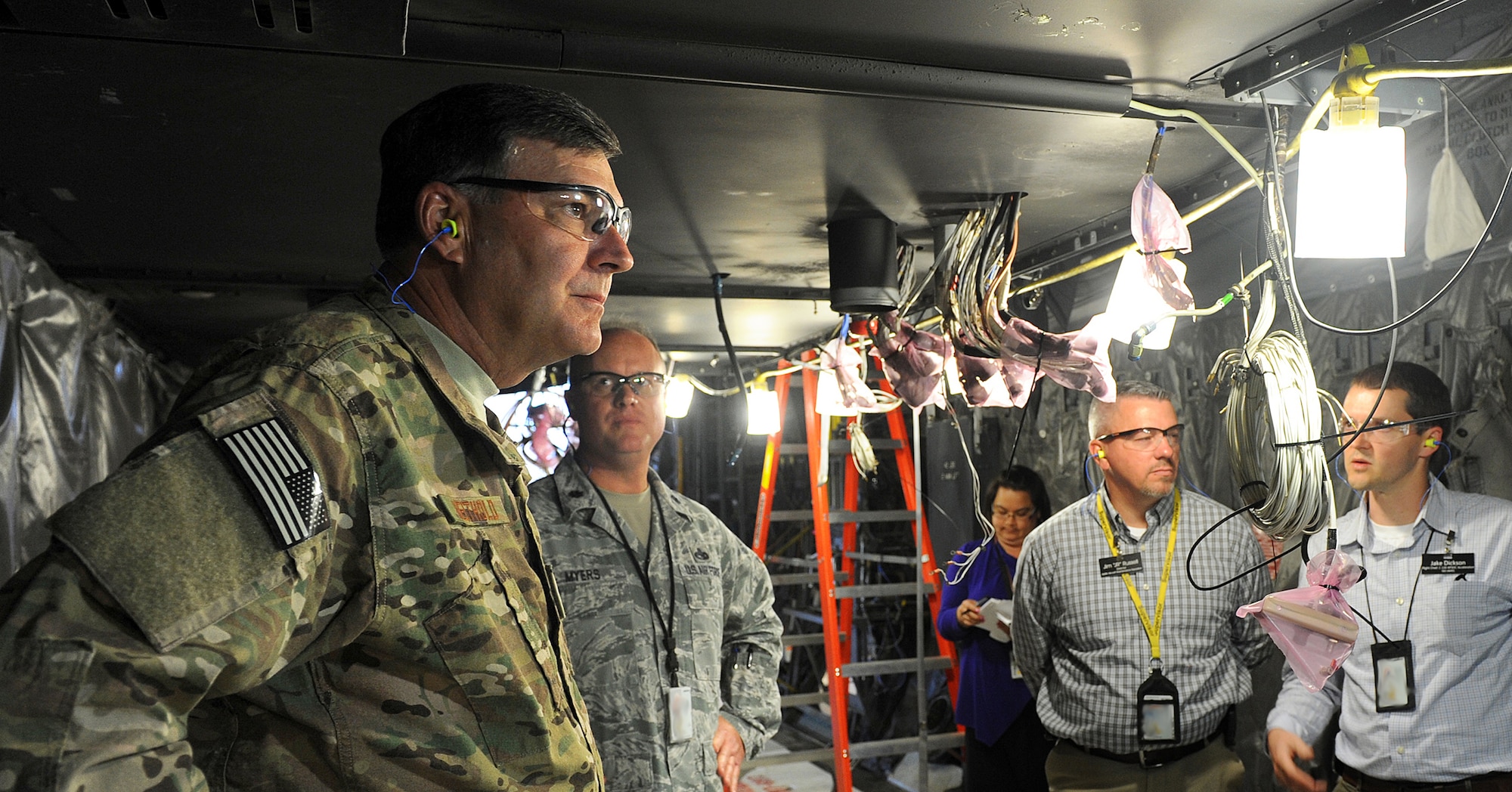 Lt. Gen. Bradley Heithold, Air Force Special Operations Command commander, listens to an overview of the acceleration plan at Robins Air Force Base. Heithold was briefed on the programmed depot maintenance plan, lessons learned, the production gate flow process and the status of current aircraft on station. The 560th Aircraft Maintenance Squadron, included among a team of enterprise partners from across the installation, successfully delivered the first AC-130U gunship to Hurlburt Field, Fla., in February. (U.S. Air Force photo by Tommie Horton)