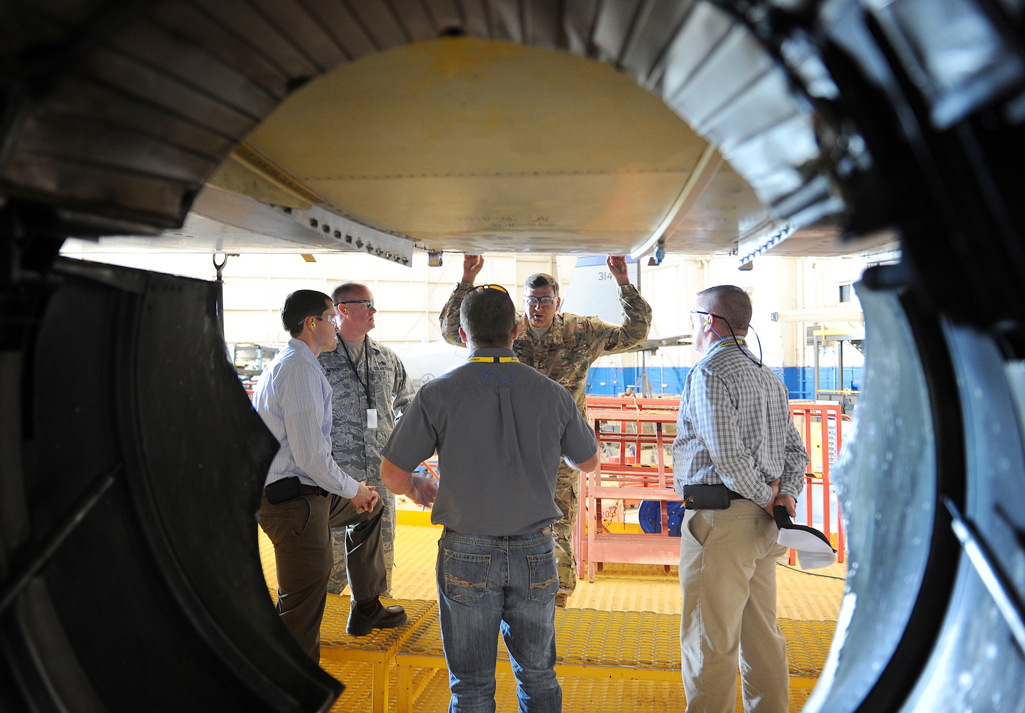 Lt. Gen. Bradley Heithold, Air Force Special Operations Command commander, takes a moment to talk with members of the C-130 AFSOC Acceleration Flight during his tour of the production lines at Robins Air Force Base. During the tour, Heithold was briefed on the programmed depot maintenance plan, lessons learned, the production gate flow process and the status of current aircraft on station. (U.S. Air Force photo by Tommie Horton)