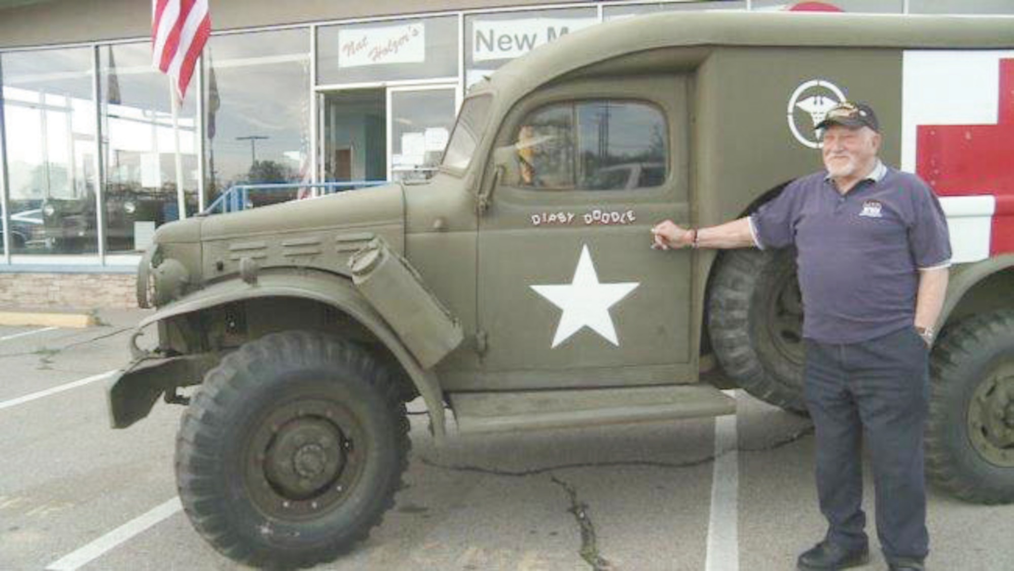 World War II veteran Thomas Grasser stands with the ambulance he drove in the European Theater. He stumbled across the vehicle at the local New Mexico Museum of Military History. (Courtesy photo)