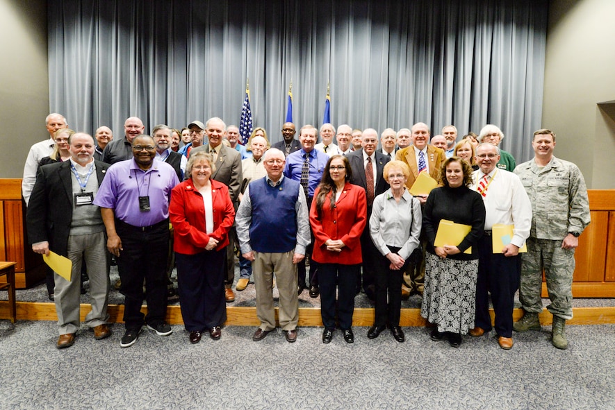 Col. Shaun Hick, Defense Enterprise Application and Management System program manager poses with a group of 38 Vietnam veterans after a Vietnam War 50th Anniversary Commemoration Ceremony held inside the Air Force Materiel Command headquarters building, March 16, 2016. During the ceremony each veteran or their family member received a commemorative pin and copy of the Proclamation by the President of the United States commemorating the 50th Anniversary of the Vietnam War. (U.S. Air Force photo by Wesley Farnsworth / Released)  