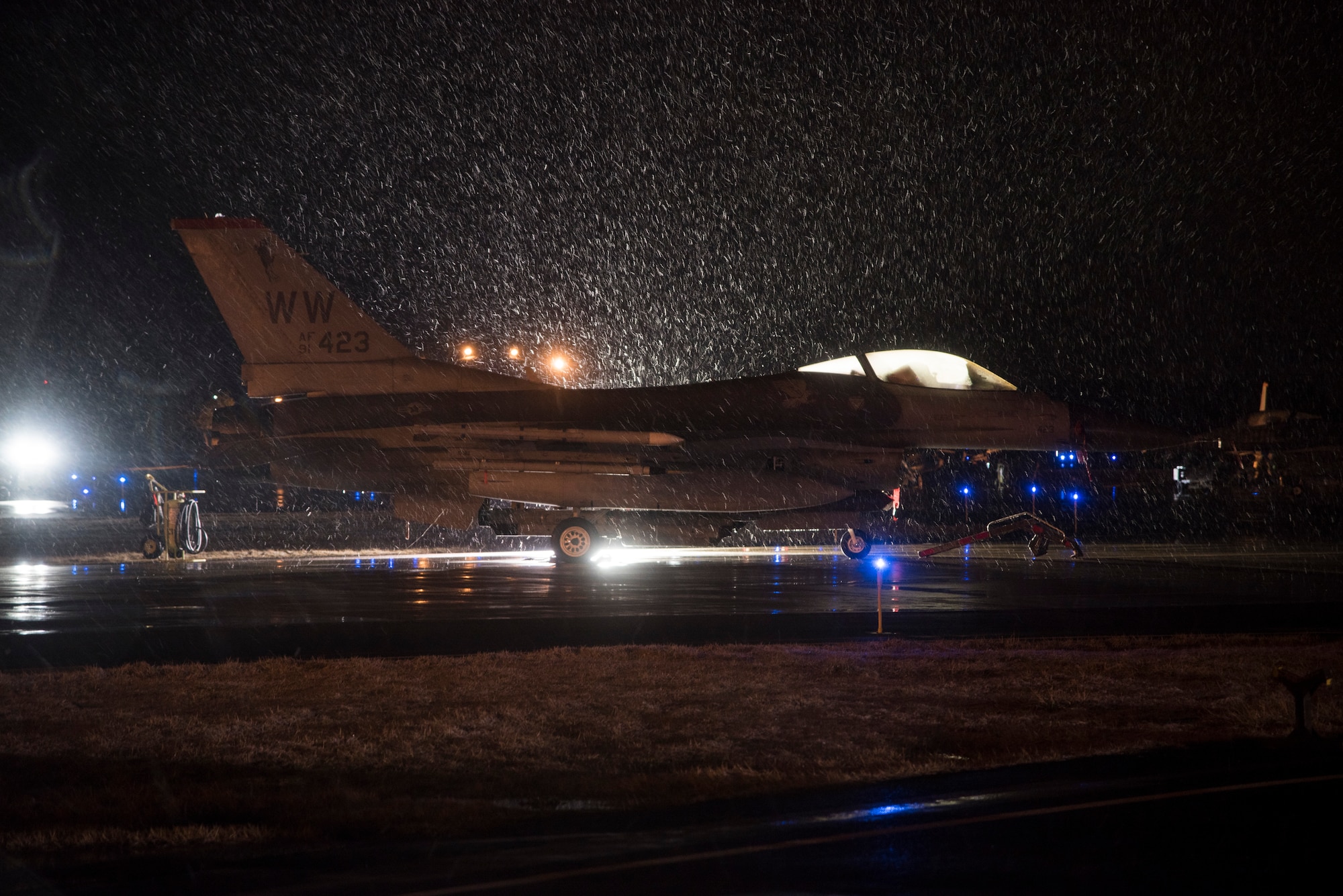 An F-16 Fighting Falcon idles in the snow as it waits to be armed during exercise Beverly Sunrise 16-03 at Misawa Air Base, Japan, March 22, 2016. The 35th Fighter Wing’s collections of F-16s are multi-role fighter aircraft, capable of performing Suppression of Enemy Air Defenses tactics, and belong to the only SEAD wing in the Pacific Air Forces. (U.S. Air Force photo by Senior Airman Patrick S. Ciccarone)