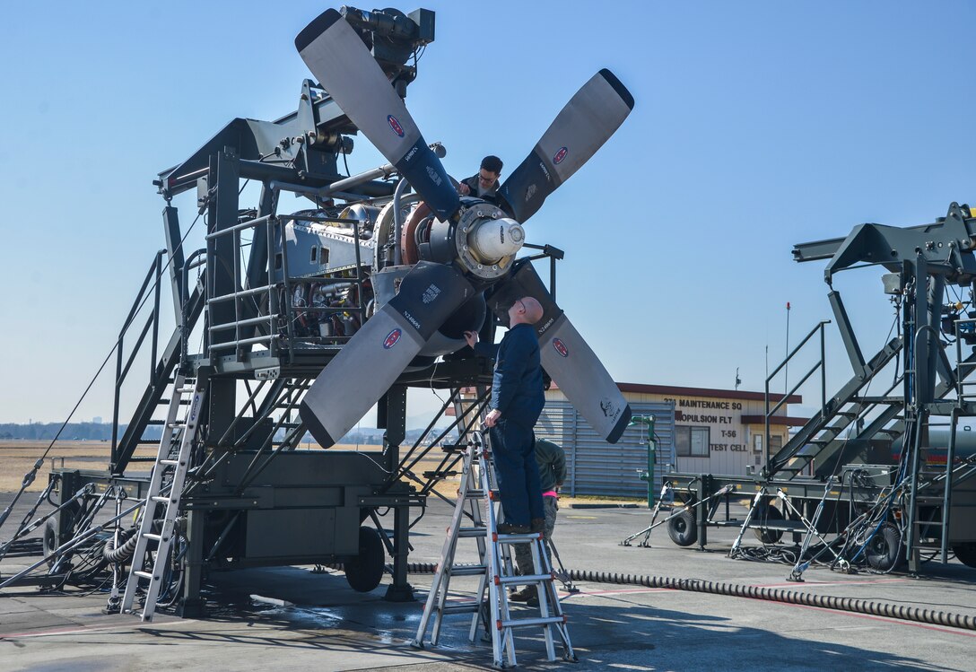 Members of the 374th Maintenance Squadron propulsion flight inspect a propeller prior to it being tested at Yokota Air Base, Japan, March 3, 2016. The test cell is where engines and propellers go through a final inspection to ensure they run efficiently and are free of any leaks. (U.S. Air Force photo by Senior Airman David Owsianka/Released)