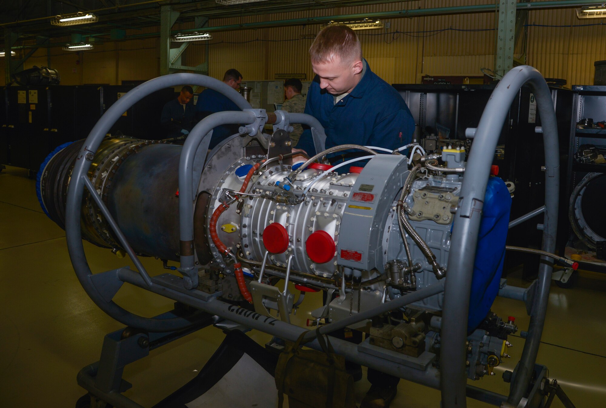 Airman 1st Class Joshua Mills, 374th Maintenance Squadron aerospace propulsion journeyman, works on a compressor discharger pressure cap on a C-130 Hercules engine at Yokota Air Base, Japan, March 3, 2016. The props flight provides engines and propellers to the C-130 Hercules to ensure the aircraft can fly to perform airlift and humanitarian missions throughout the Indo-Asia Pacific Region. (U.S. Air Force photo by Senior Airman David Owsianka/Released) 