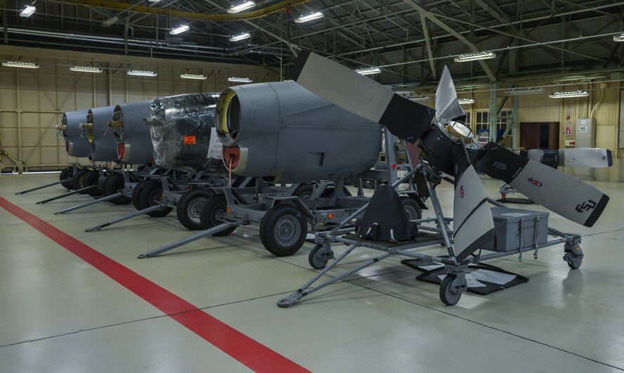 Multiple quick engine change kits and a propeller wait to be inspected in the propulsion flight hangar at Yokota Air Base, Japan, March 3, 2016. The quick engine change section inspects, replaces and cleans all of the engine parts such as the wiring, harnesses and structural frame. (U.S. Air Force photo by Senior Airman David Owsianka/Released)