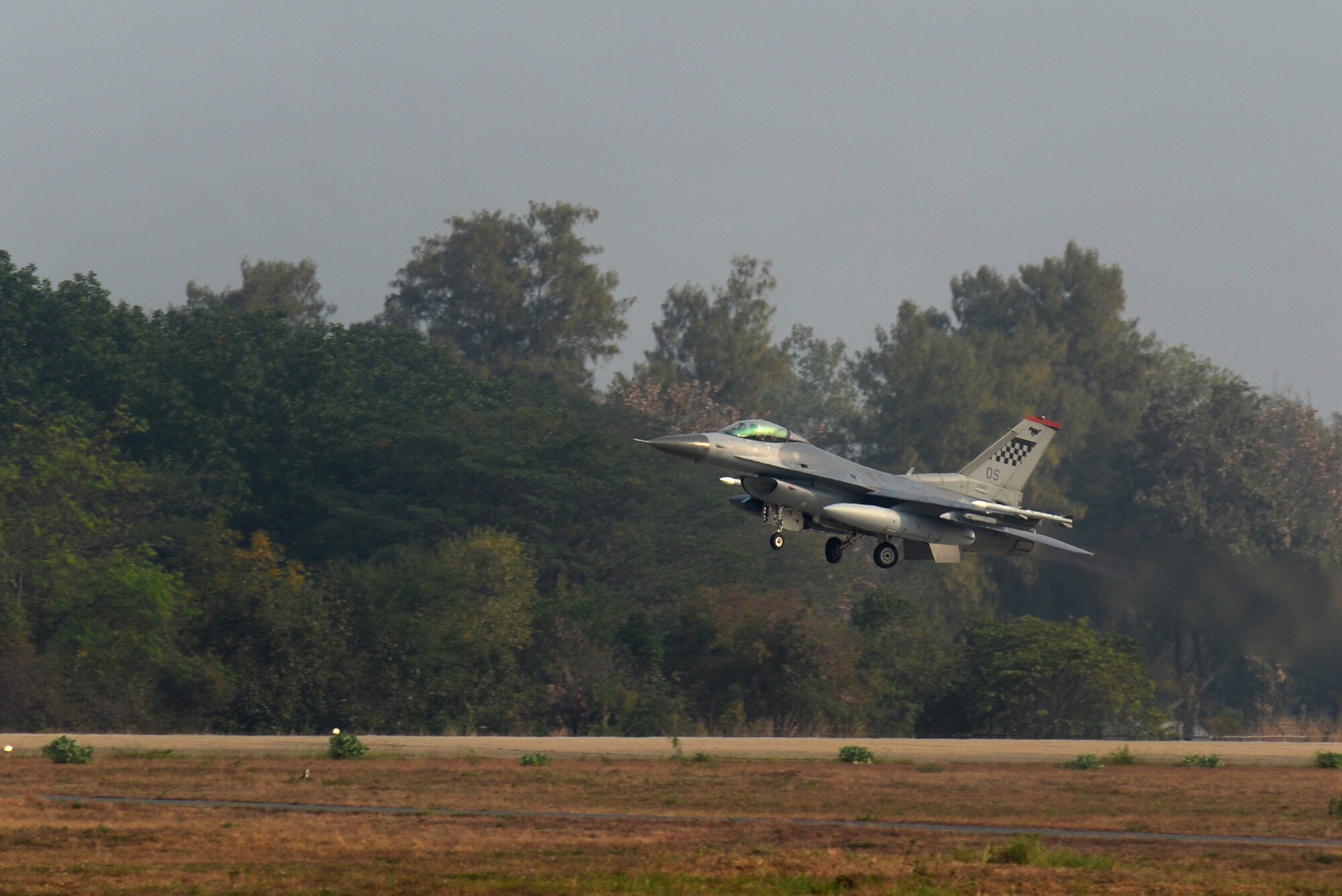 A U.S. Air Force F-16 Fighting Falcon takes off Feb. 15, 2016, at Korat Royal Thai Air Force Base, Thailand. Piloted by 1st Lt. Brittany Trimble, 36th Fighter Squadron pilot, this F-16 along with several other aircraft and pilots visited Thailand to participate in Cobra Gold 2016, a multinational exercise. This trip was Trimble’s first experience flying in a multinational exercise. (U.S. Air Force photo by Staff Sgt. Amber E. N. Jacobs)