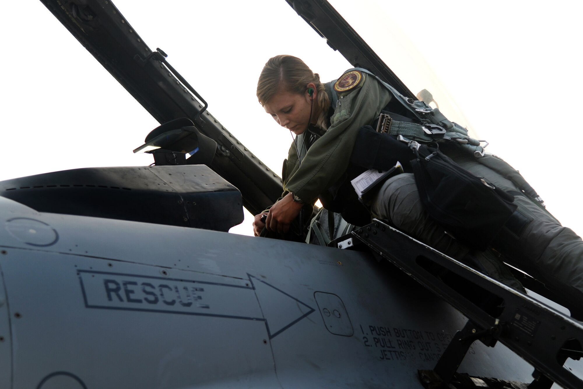 U.S. Air Force 1st Lt. Brittany Trimble, 36th Fighter Squadron pilot, plugs her air flight crew equipment into an F-16 Fighting Falcon before takeoff, Feb. 15, 2016, at Korat Royal Thai Air Force Base, Thailand. Women were first allowed to enter pilot training in 1976 and in 1993 women were finally authorized to enter fighter pilot training. Trimble is one of only 676 female pilots who serve in the U.S. Air Force. There are 12,823 pilots Air Force wide. (U.S. Air Force photo by Staff Sgt. Amber E. Jacobs)