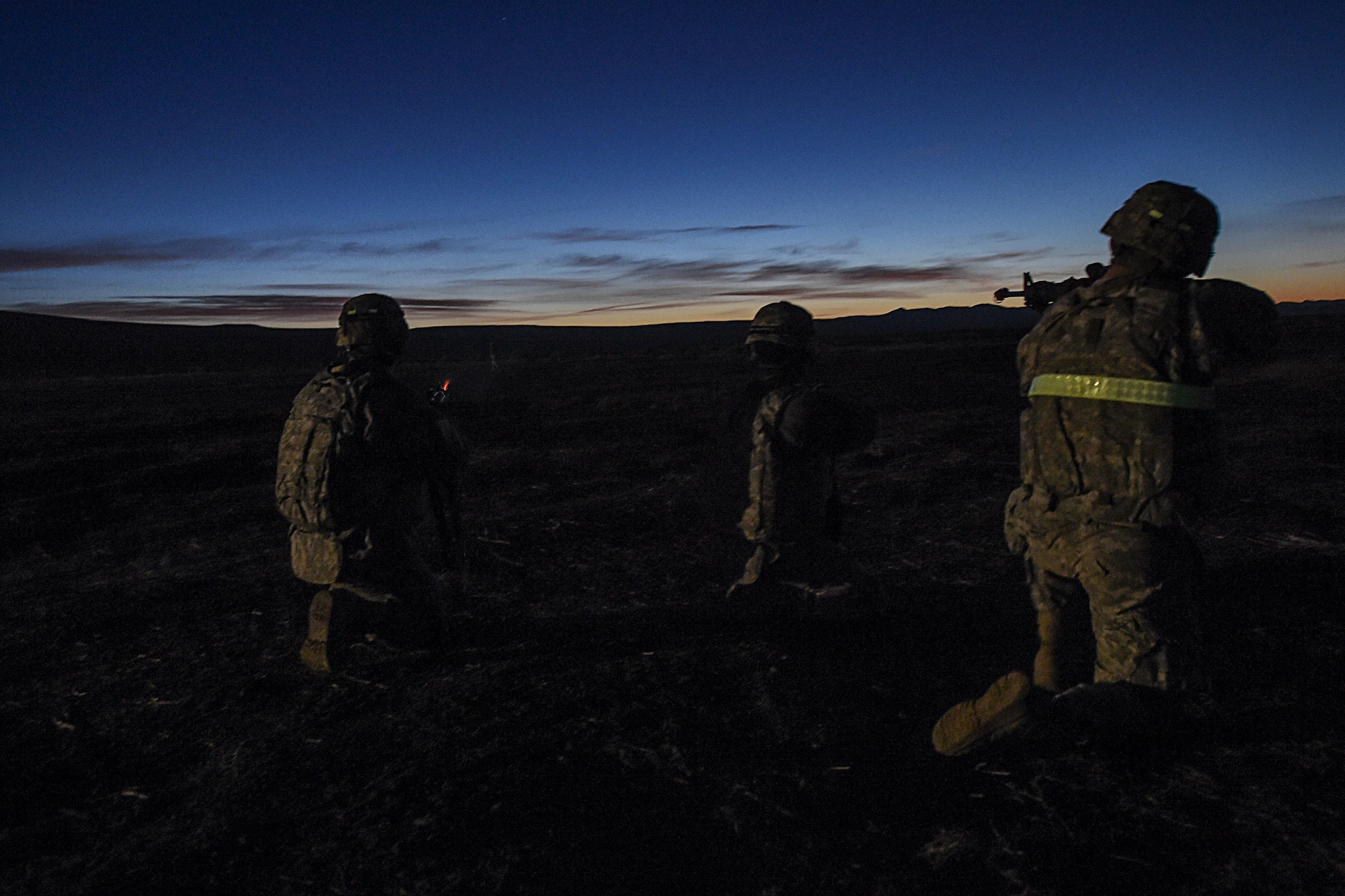 Soldiers assigned to the 688th Rapid Port Opening Element stationed at Joint Base Langley-Eustis, Va., opens fire at the opposition force during Exercise Turbo Distribution 16-02, March 17, 2016, at Amedee Army Airfield, Calif. Turbo Distribution is used to evaluate mobility operations and expeditionary combat support. Unlike traditional, simulation based exercises, TD provides a dynamic venue with scenarios designed to challenge participants executing complex operations in a deployed environment. (U.S. Air Force photo by Staff Sgt. Robert Hicks/Released)