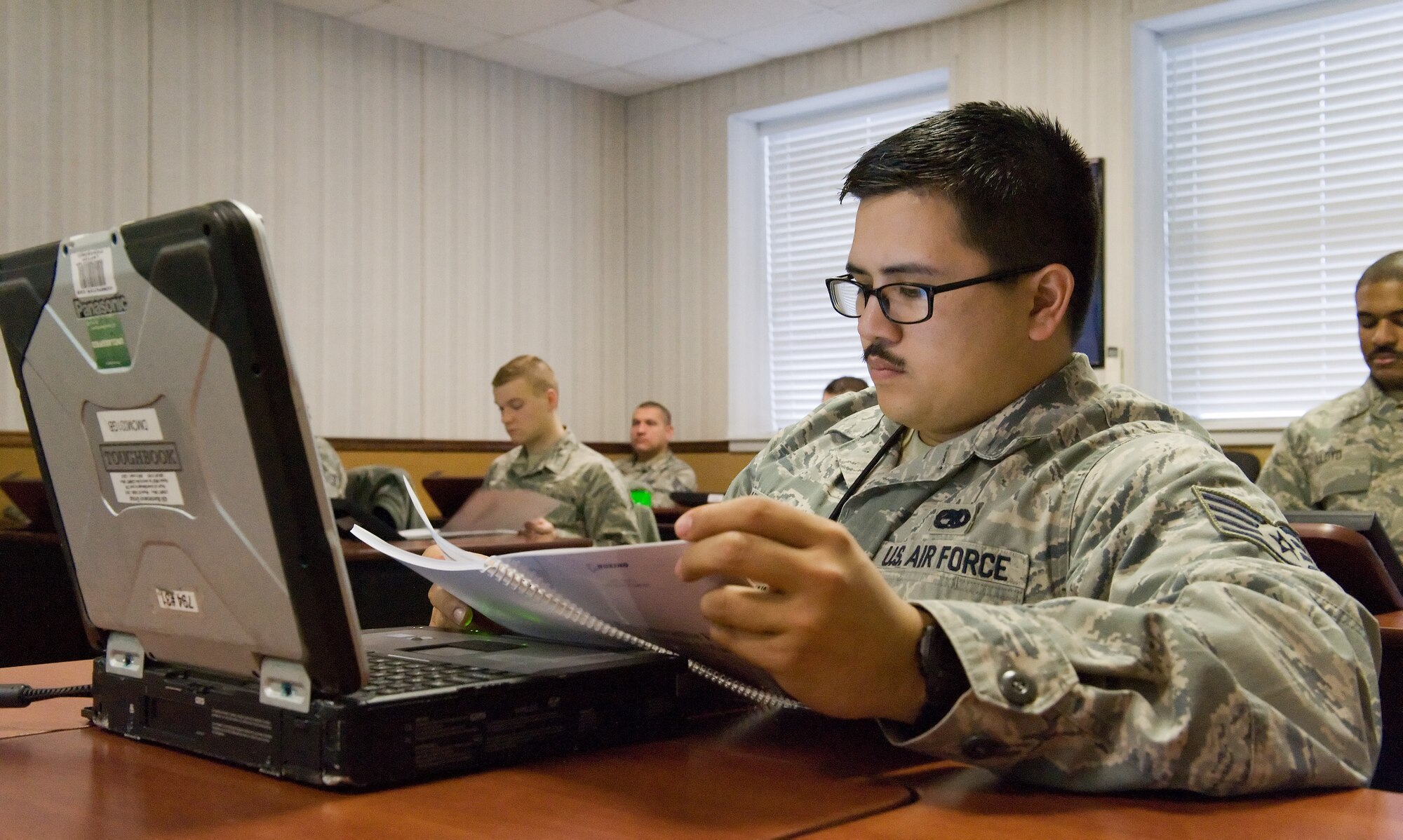 Staff Sgt. Sean Carlson, 736th Aircraft Maintenance Squadron C-17A Globemaster III communication/countermeasures/navigation systems craftsman, looks over a training guide for the C-17 Interactive Electronic Manuals Feb. 24, 2016, on Dover Air Force Base, Del. The C-17 IETM is a full and inclusive suite of organizational level maintenance in one single electronic technical order consisting of job guides, fault isolation, illustrated parts breakdown, etc. (U.S. Air Force photo/Roland Balik)
