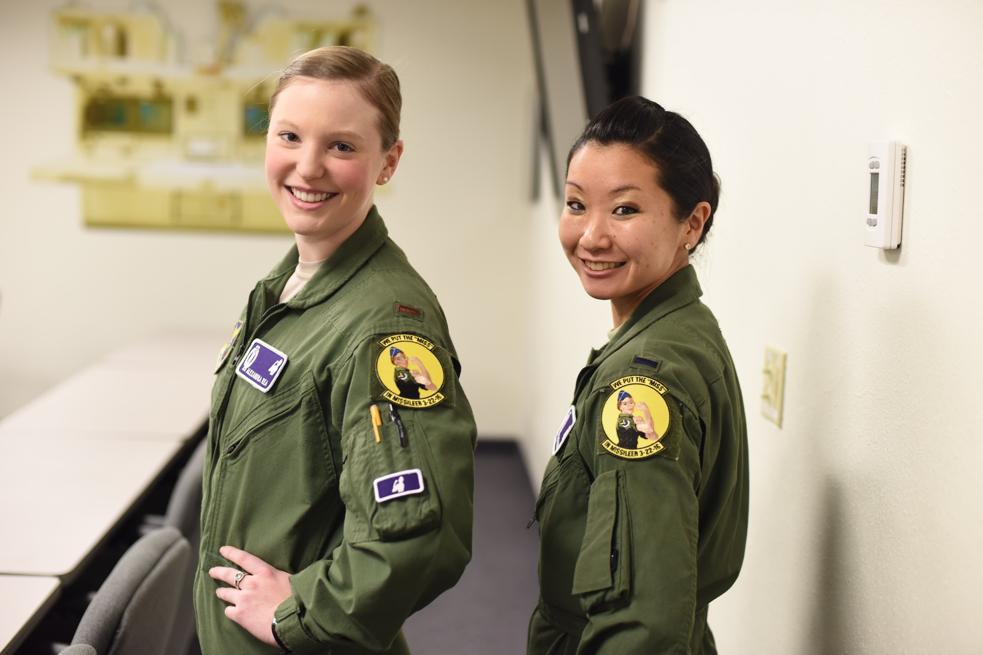 2nd Lt. Alexandra Rea, 490th Missile Squadron ICBM combat crew deputy director, left, and 1st Lt. Elizabeth Guidara, 12th Missile Squadron combat crew deputy director, pose for a photograph after a training session at the Building 500 Missile Procedures Trainer March, 21, 2016. During their assignment, the missileers will maintain a 24-hour alert shift to sustain an active alert status of our nation’s intercontinental ballistic missile force. (U.S. Air Force photo/Airman Collin Schmidt)