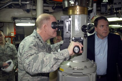 U.S. Air Force Lt. Gen. Stephen W. Wilson, U.S. Strategic Command (USSTRATCOM) deputy commander, looks through the periscope of the USS Wyoming (SSBN 742) at Naval Submarine Base Kings Bay, Ga., March 23, 2016. While there, Wilson and Mr. Tom Janssen, Strategic Command Consultation (SCC) Committee representative (right), presented the 2015 Omaha Trophy, ballistic missile submarine category, to U.S. Navy Cmdr. Kenneth M. Curtin Jr., commanding officer of USS Wyoming Gold Crew (not pictured), and U.S. Navy Cmdr. Wayne C. Wall, commanding officer of USS Wyoming Blue Crew (not pictured), during a ceremony in recognition of the USS Wyomingâ€™s contributions to USSTRATCOM's global strategic missions. The Omaha Trophy, which dates back to the U.S. Air Force's Strategic Air Command, was originally created by the SCC in 1971. At the time, a single trophy was presented annually as a token of appreciation to USSTRATCOM's best wing. Since then, the tradition has evolved to unit-level awards that recognize the command's premier intercontinental ballistic missile (ICBM) wing, ballistic missile submarine, strategic bomber wing and global operations (space/cyberspace) unit. This year, a new category was added to include the combatant command's top strategic aircraft wing. (U.S. Navy photo courtesy of Commander, Submarine Group Ten Public Affairs) Story Available: https://www.stratcom.mil/news/2016/595/-/
