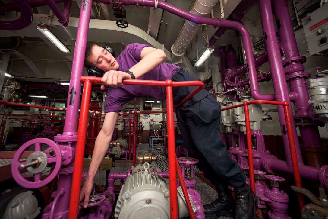 Navy Seaman Apprentice Jaren Solt throttles the pressure of a JP-5 fuel pump on the aircraft carrier USS Dwight D. Eisenhower in the Atlantic Ocean, March 22, 2016. The Eisenhower is conducting a Composite Training Unit Exercise to prepare for a future deployment. Solt is an airman apprentice. Navy photo by Petty Officer 3rd Class Anderson W. Branch