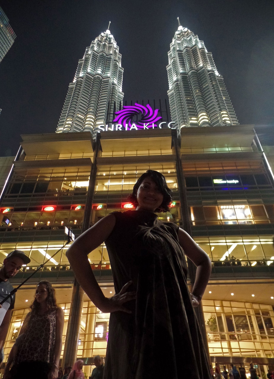 160314-N-IE405-250 KUALA LUMPUR, Malaysia (Mar. 14, 2016) - Mass Communication Specialist 2nd Class Indra Bosko, assigned to U.S. 7th Fleet, poses in front of Petronas Towers. U.S. 7th Fleet is on patrol in the 7th Fleet area of operations in support of security and stability in the Indo-Asia-Pacific. (Photo by Viji Vengadasalam/Released)