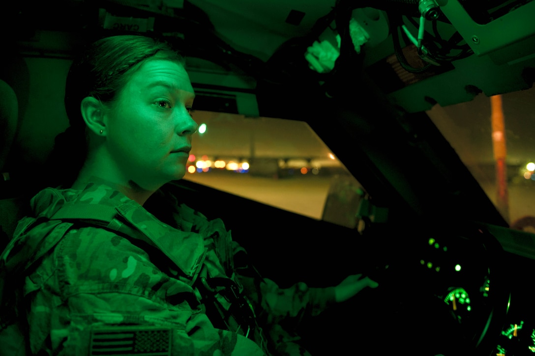 As seen through a night-vision device, Air Force Senior Airman Shawna Grocott drives a mine-resistant, ambush-protected, all-terrain vehicle during a patrol at Bagram Airfield, Afghanistan, March 23, 2016. Air Force photo by Tech. Sgt. Robert Cloys