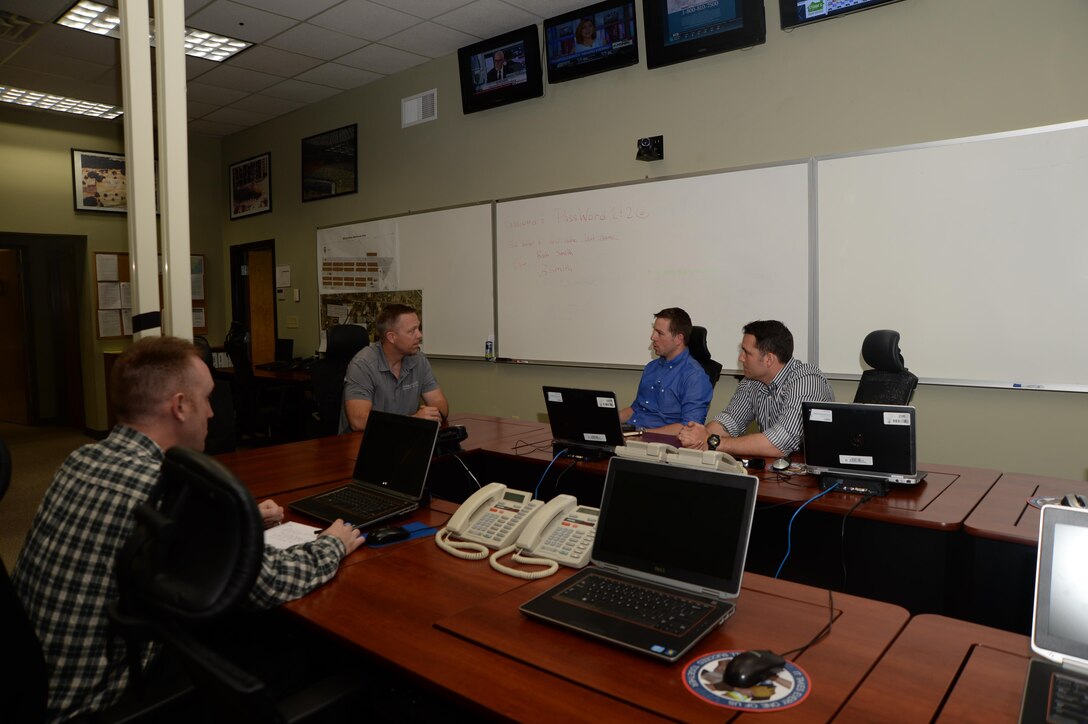 Steven Dancer, (center) installation emergency manager, Marine Corps Logistics Base Albany, meets with members of the 97th Civil Affairs Battalion, Ft. Bragg, N.C., to discuss procedures of the emergency operations center aboard the base recently. Members of the battalion trained to sharpen civil affairs skills needed during deployments.