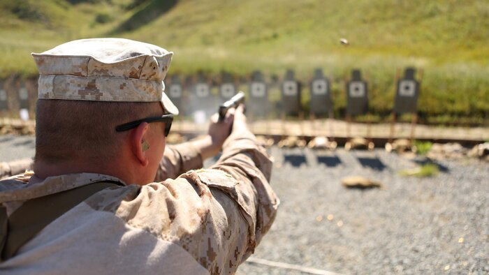 A Marine with Company A, 1st Reconnaissance Battalion performs a pistol drill during a combat marksmanship program led by Expeditionary Operations Training Group March 17, 2016 at Marine Corps Base Camp Pendleton, California. The shooting package helps to better prepare these Marines for an upcoming deployment with the 11th Marine Expeditionary Unit.