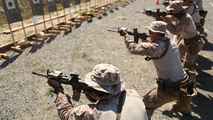 Marines with Company A, 1st Reconnaissance Battalion stand on line and perform rifle drills during a combat marksmanship program led by Expeditionary Operations Training Group March 17, 2016 at Marine Corps Base Camp Pendleton, California. The shooting package helps to better prepare these Marines for an upcoming deployment with the 11th Marine Expeditionary Unit.