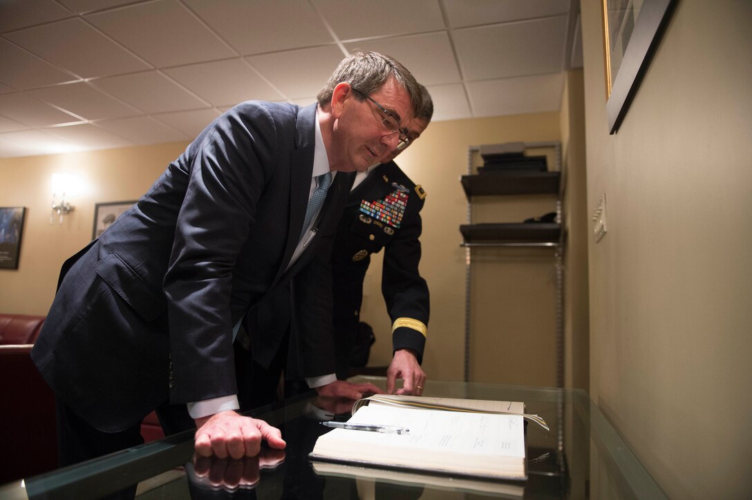 Defense Secretary Ash Carter signs a guest book during his visit to the U.S. Military Academy in West Point, N.Y., March 23, 2016. DoD photo by Petty Officer 1st Class Tim D. Godbee