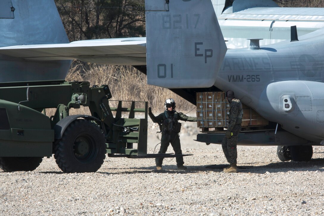 Marines unload ammo from a Marine Corps MV-22 Osprey during Exercise Ssang Yong 2016 in Pohang, South Korea, March 11, 2016. Marine Corps photo by Sgt. Briauna Birl