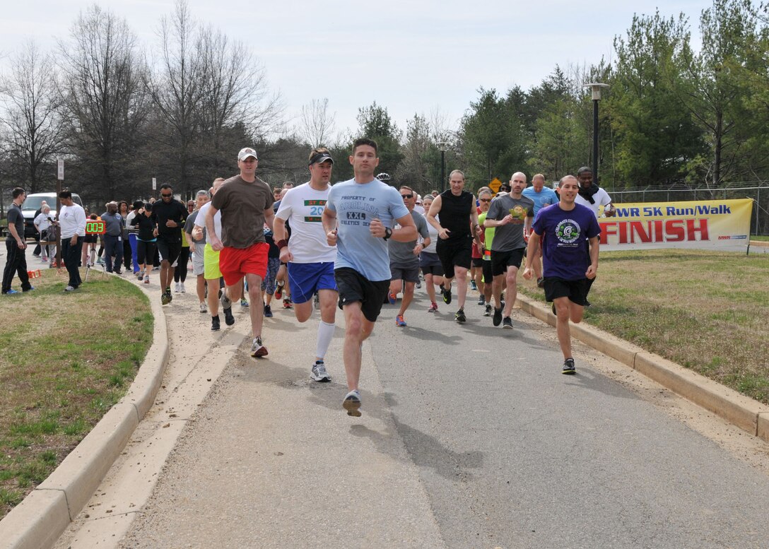 Walkers and runners leave the starting line at the McNamara Headquarters Complex Spring Fling 5K at Fort Belvoir, Virginia, March 20.