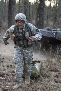 Sgt. Abraham Amavisca, a practical nursing noncommissioned officer with the 7305th Medical Training Support Battalion out of Sacramento, California pulls a basic rescue system loaded with a 40-pound mannequin through an obstacle course, March 8, 2016 during the Army Reserve Medical Command's 2016 Best Warrior competition at Fort Gordon, Ga. (U.S. Army photo by Sgt. 1st Class Brian Hamilton 108th Training Command- Initial Entry Training Public Affairs)