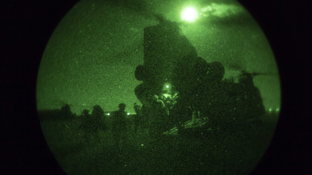 U.S. Marines with Task Force Spartan, 26th Marine Expeditionary Unit, offload from a CH-47 Chinook helicopter during their insert into Kara Soar, while conducting their mission in support of Operation Inherent Resolve, in Kara Soar, Iraq, March 17, 2016. Operation Inherent Resolve is an international U.S. led coalition military operation created as part of a comprehensive strategy to degrade and defeat the Islamic State of Iraq and the Levant.