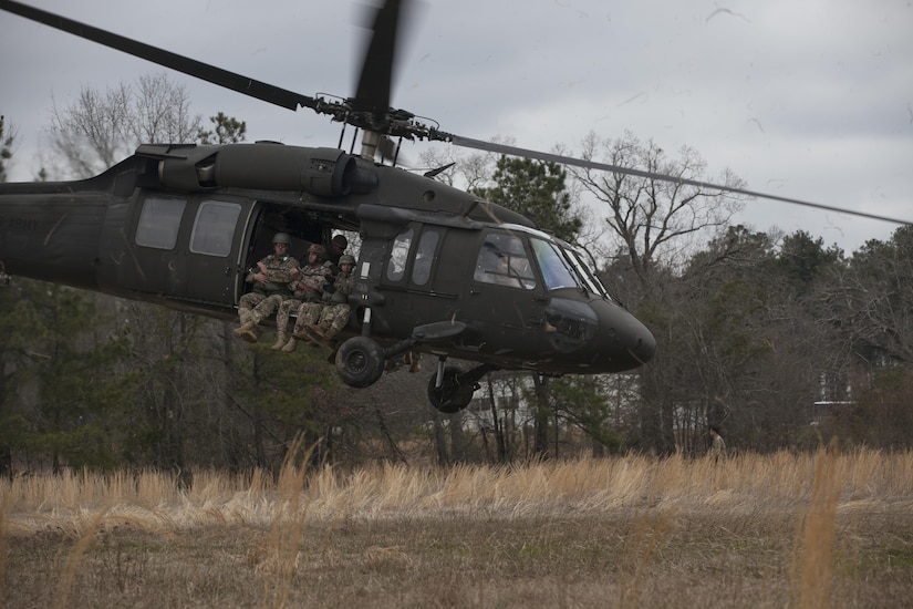 U.S. Army and German paratroopers take off in a UH-60 Black Hawk for a multi-national airborne operation at Preston Drop Zone, Fort Gordon, Ga., Friday, March 4, 2016. The purpose of Operation "Glück Ab" is to foster German and U.S. relationships, develop interoperability during training, and provide a basis for future operations in training and real world environments.   (U.S. Army photo by Spc. Rachel Diehm/Released)