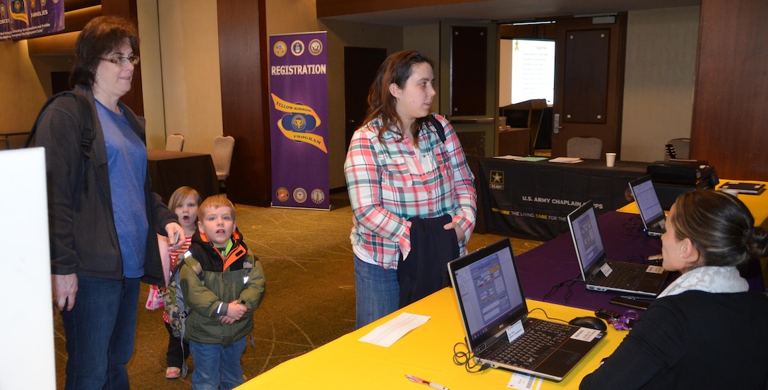 Soldiers and Family members register and receive welcome packets for the 88th Regional Support Command Yellow Ribbon Reintegration Program Event in downtown Minneapolis, Minn., March 18. The Yellow Ribbon Reintegration Program is a DoD-wide effort to promote the well-being of National Guard and Reserve members, their families and communities, by connecting them with resources throughout the deployment cycle. Through Yellow Ribbon events, service members and loved ones connect with local resources Honoring veterans and families before, during, and after deployments.