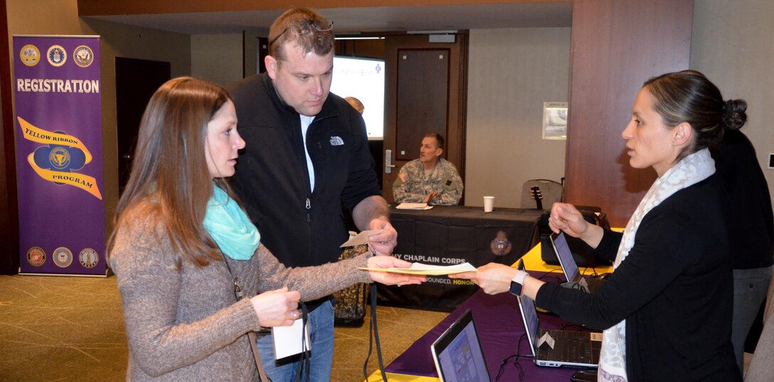 Soldiers and Family members register and receive welcome packets for the 88th Regional Support Command Yellow Ribbon Reintegration Program Event in downtown Minneapolis, Minn., March 18. The Yellow Ribbon Reintegration Program is a DoD-wide effort to promote the well-being of National Guard and Reserve members, their families and communities, by connecting them with resources throughout the deployment cycle. Through Yellow Ribbon events, service members and loved ones connect with local resources honoring veterans and families before, during and after deployments.