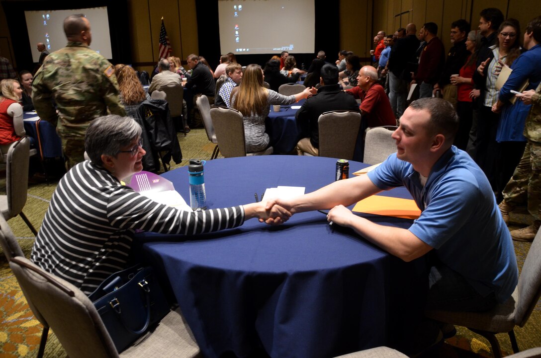 Soldiers and Family members introduce themselves during the opening session of the 88th Regional Support Command Yellow Ribbon Reintegration Program Event in downtown Minneapolis, Minn., March 18. The Yellow Ribbon Reintegration Program is a DoD-wide effort to promote the well-being of National Guard and Reserve members, their families and communities, by connecting them with resources throughout the deployment cycle. Through Yellow Ribbon events, service members and loved ones connect with local resources honoring veterans and families before, during and after deployments.