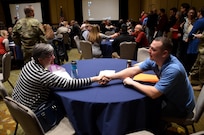 Soldiers and Family members introduce themselves during the opening session of the 88th Regional Support Command Yellow Ribbon Reintegration Program Event in downtown Minneapolis, Minn., March 18. The Yellow Ribbon Reintegration Program is a DoD-wide effort to promote the well-being of National Guard and Reserve members, their families and communities, by connecting them with resources throughout the deployment cycle. Through Yellow Ribbon events, service members and loved ones connect with local resources honoring veterans and families before, during and after deployments.