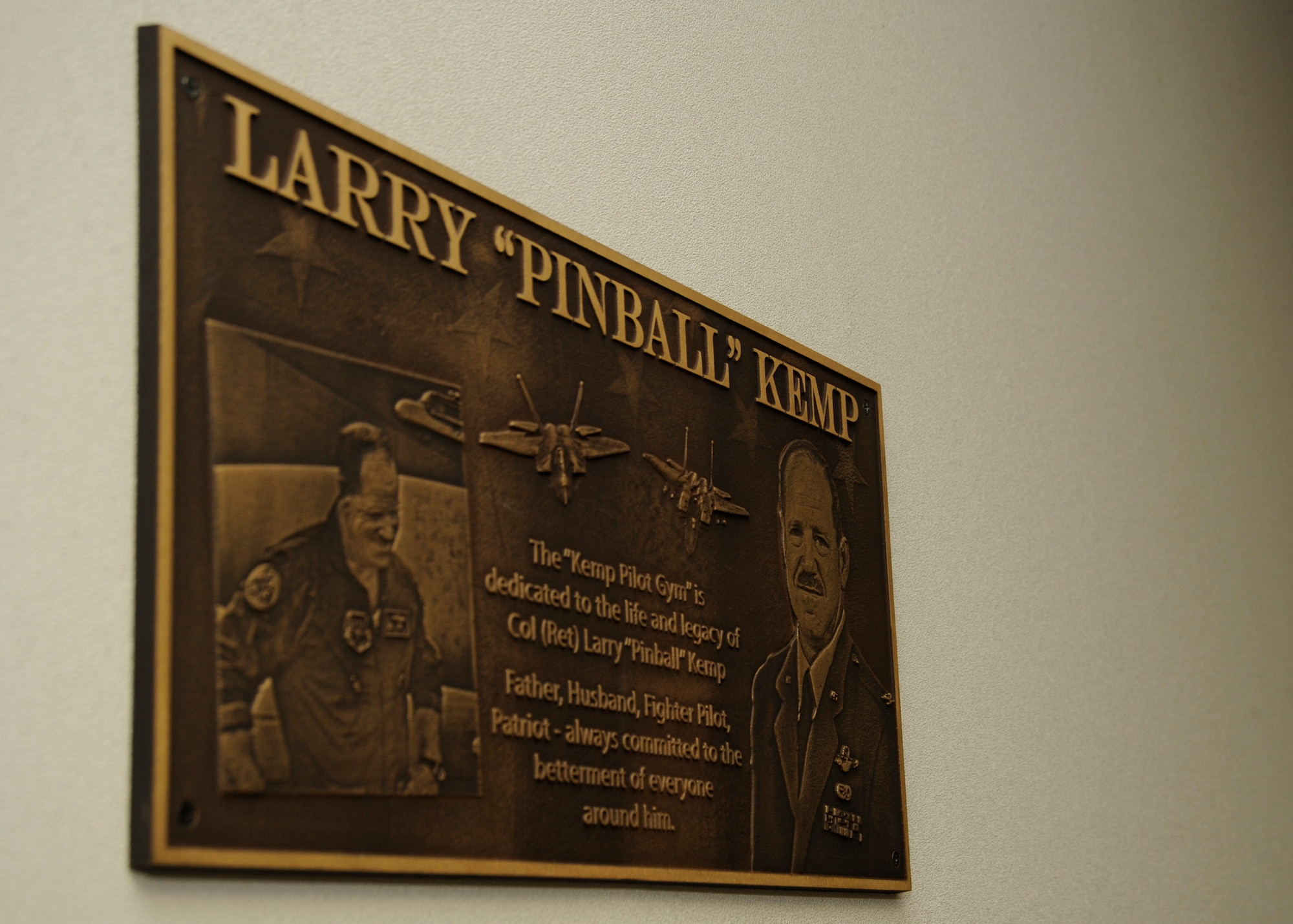 The newly named Kemp Pilot Gym plaque was unveiled March 21, at Tyndall, Air Force Base, Fla. The event dedicated the gym to the memory of Col. Larry “Pinball” Kemp. (U.S. Air Force photo by Senior Airman Solomon Cook/Released)