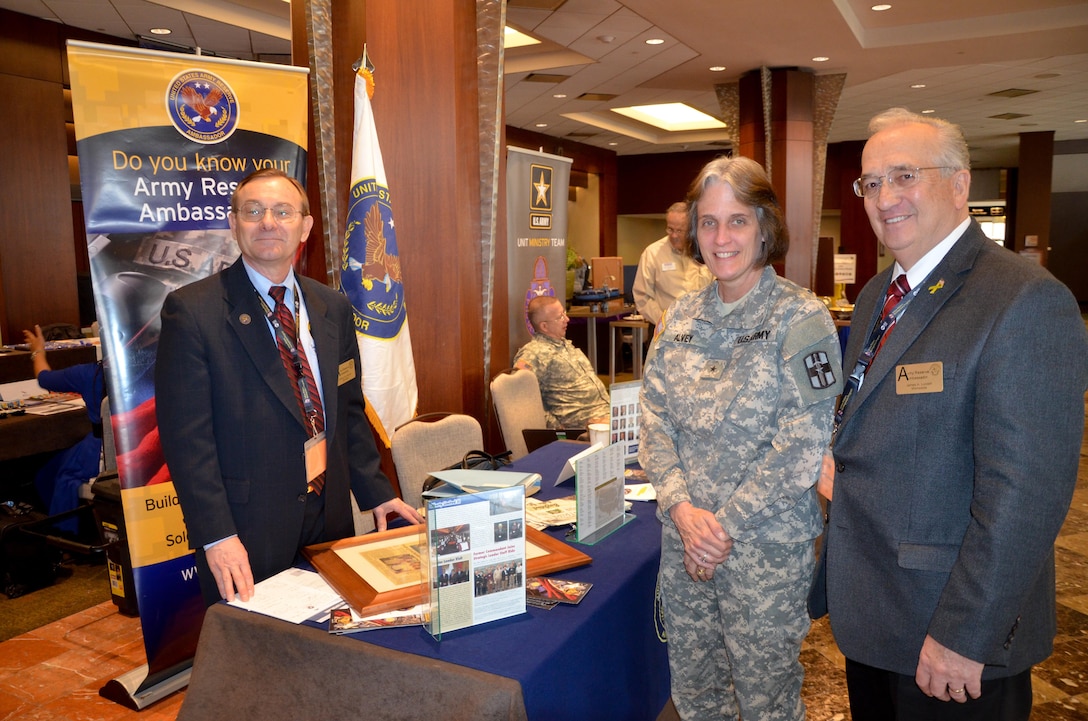 Brig. Gen. Sandra Alvey, 807th Medical Command brigadier general (center), attended the event alongside her Soldiers in the 361st Medical Logistics Company, who are 90 days post-deployment. Alvey spoke with Army Reserve Ambassadors Gerald Meyer (left), from the state of Wisconsin and James Lundell (right), from the state of Minnesota, about support available for Soldiers attending the event.